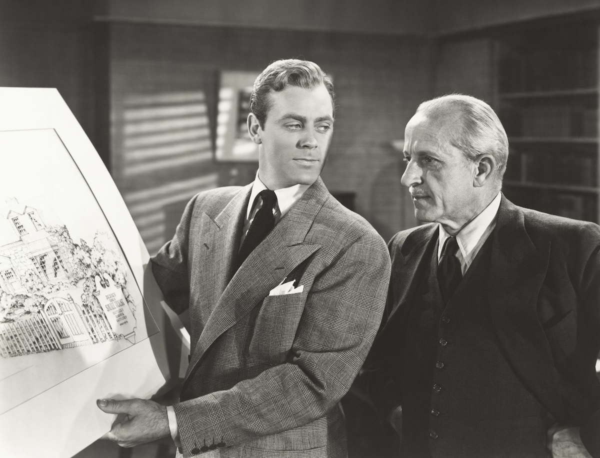 Two men reviewing an architectural drawing together